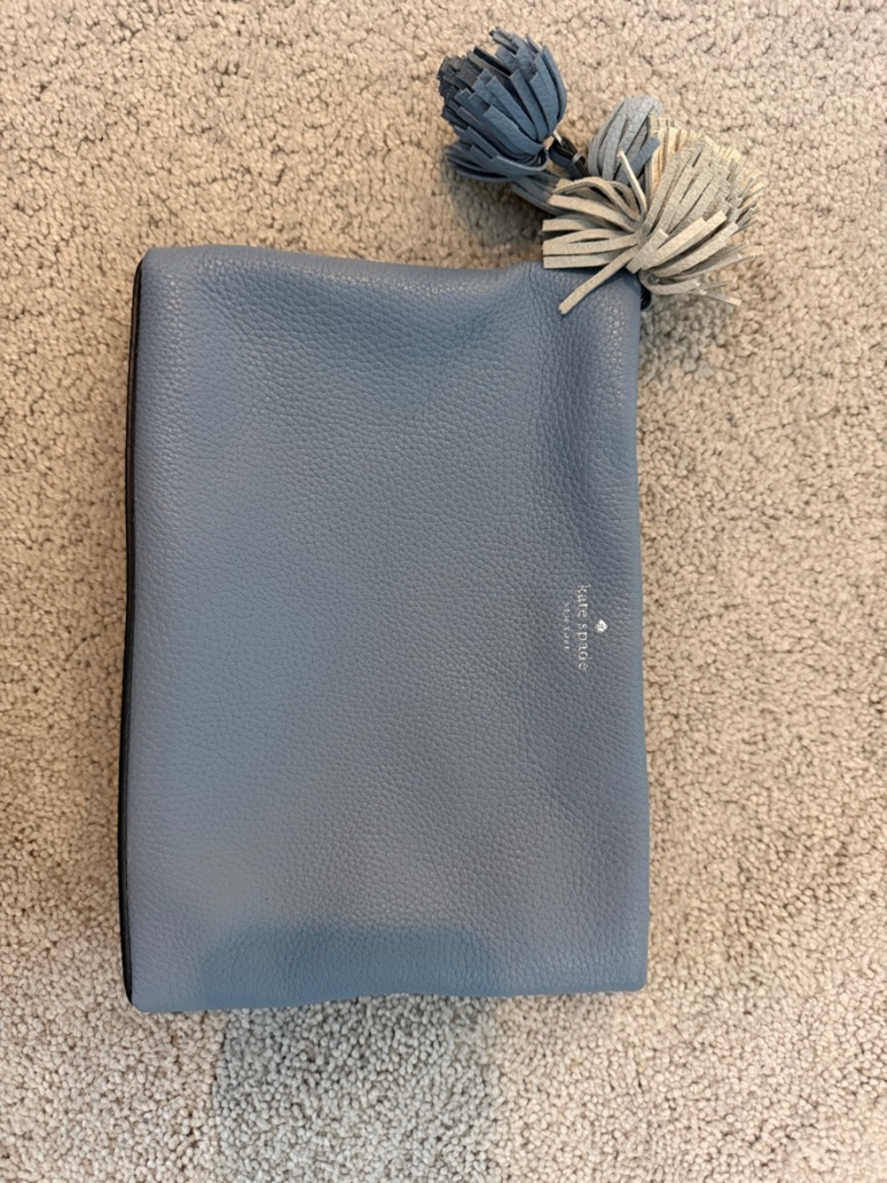 kate spade pebble leather wristlet pouch in dusty blue with dual tassels